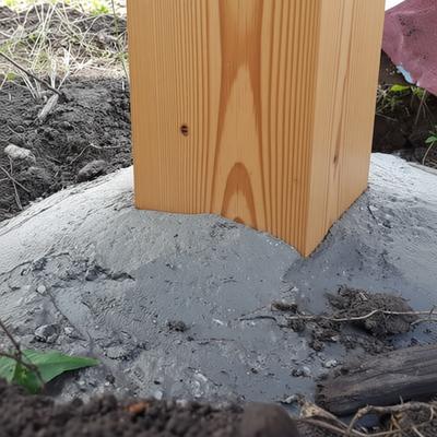 Poured concrete footing for a residential fence post by Drysdale Fencing in Geelong